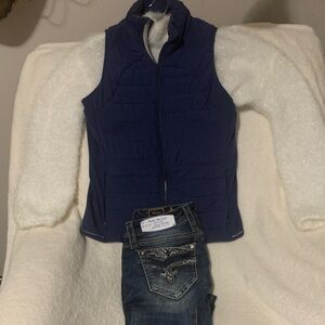Set vest sweater and pair of Rock Revival jeans and you’re all set to go.
